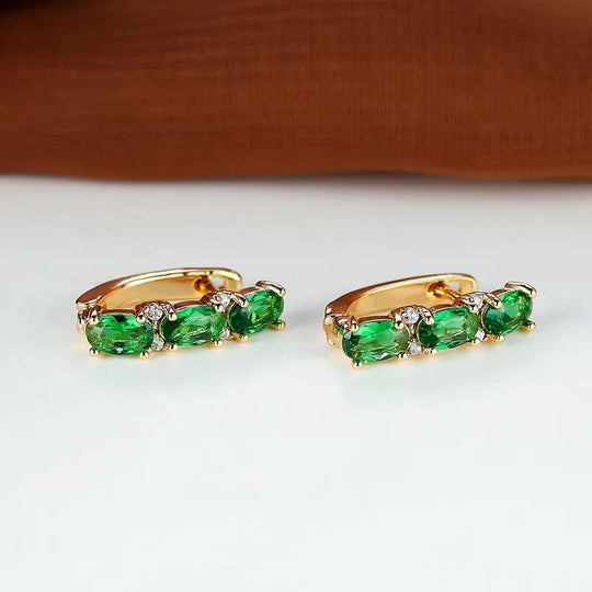 Pendientes de aro vertical de oro y esmeralda